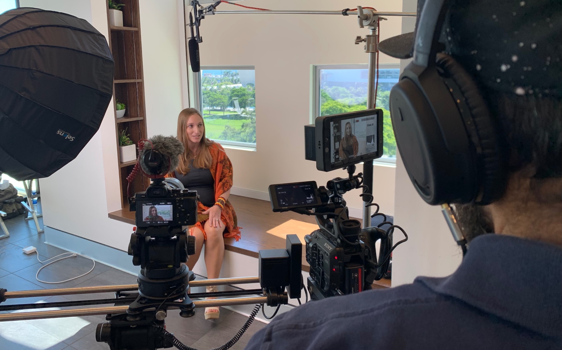 Behind the scenes on a production with cameras, monitors, lighting and sound